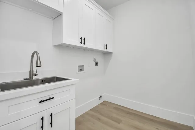 a spacious bathroom with a double vanity sink mirror and shower
