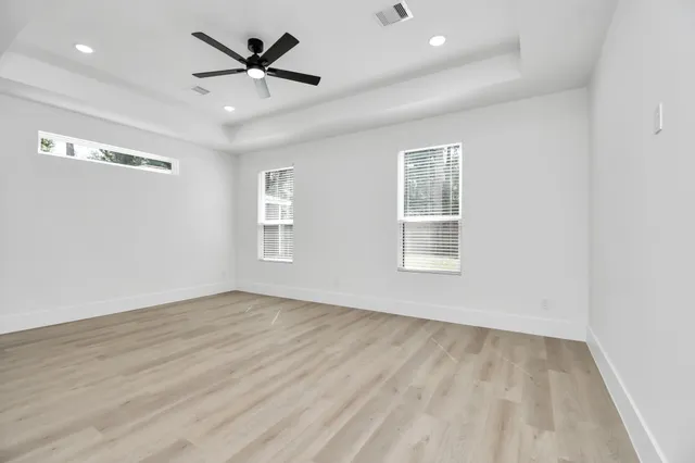 a bathroom with double vanity sinks and a mirror