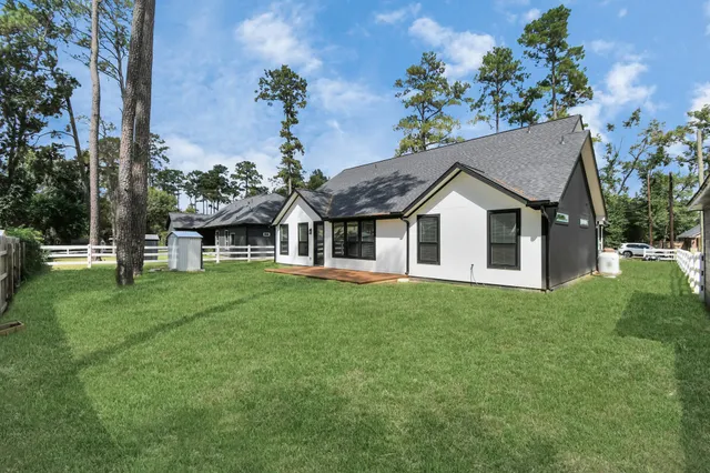 a aerial view of a house with a yard