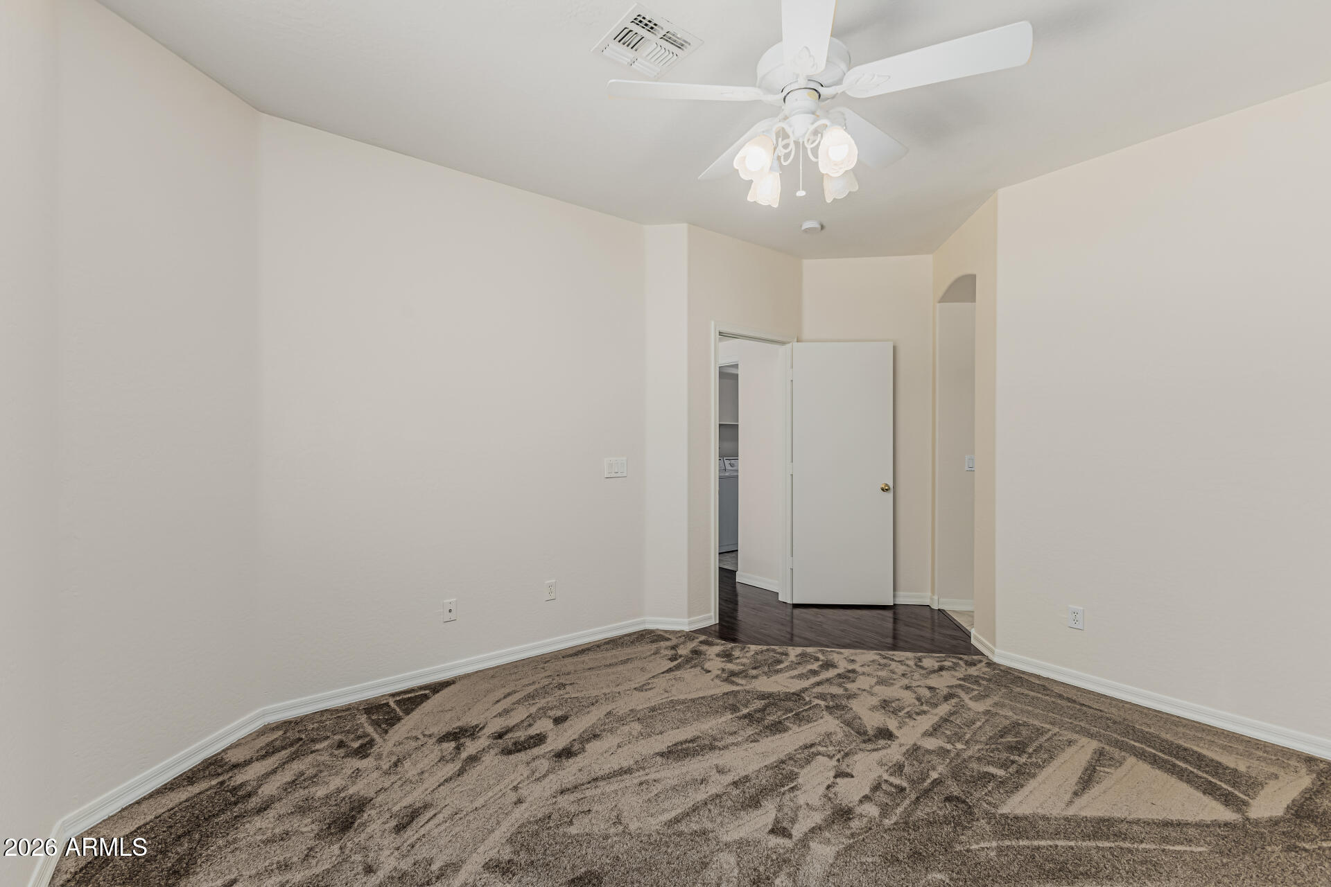 1650 South Crismon Road, Unit 16 Mesa, AZ 85209 - Photo 18 of 39 a view of a livingroom with a chandelier fan and wooden floor