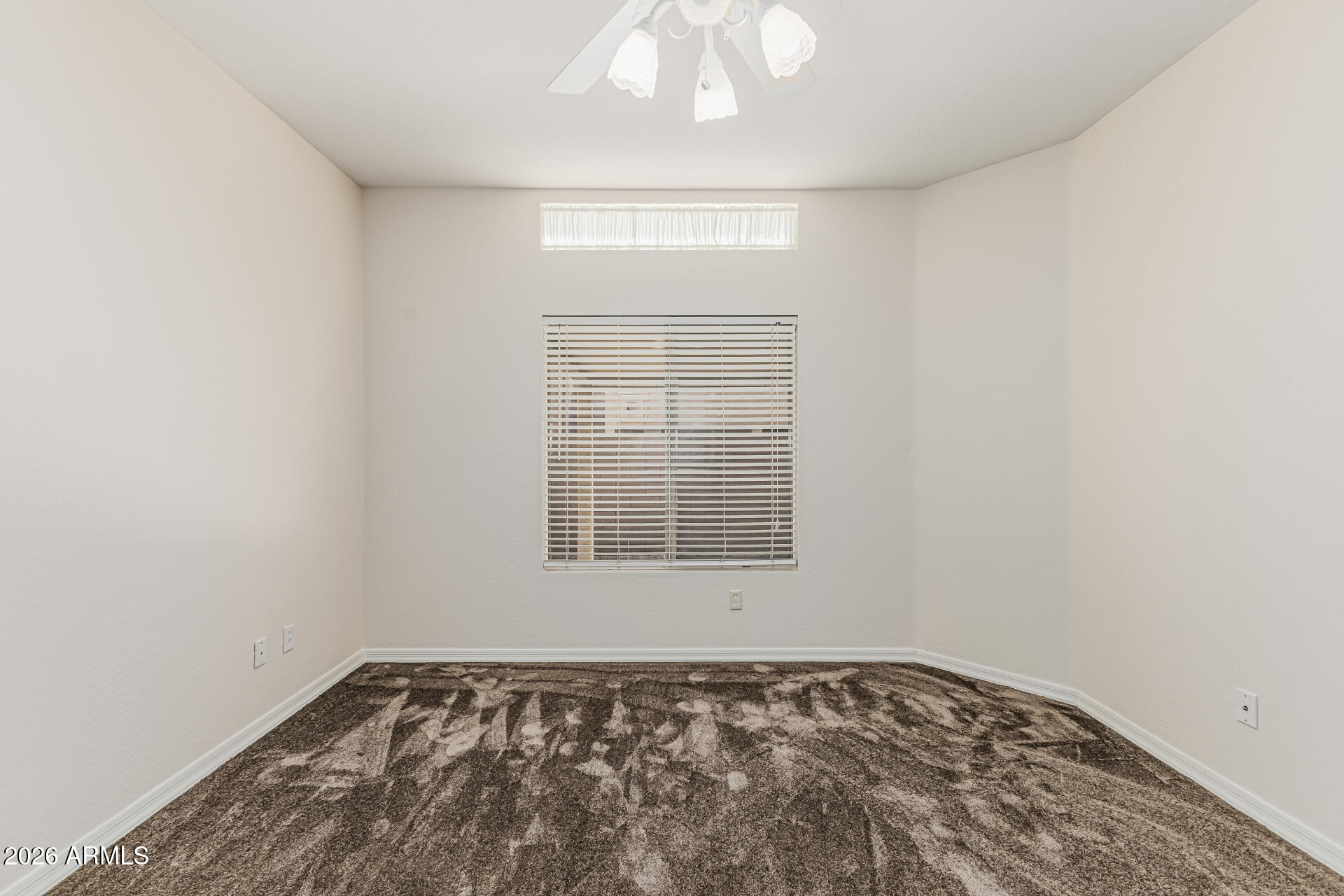 1650 South Crismon Road, Unit 16 Mesa, AZ 85209 - Photo 19 of 39 an empty room with a window