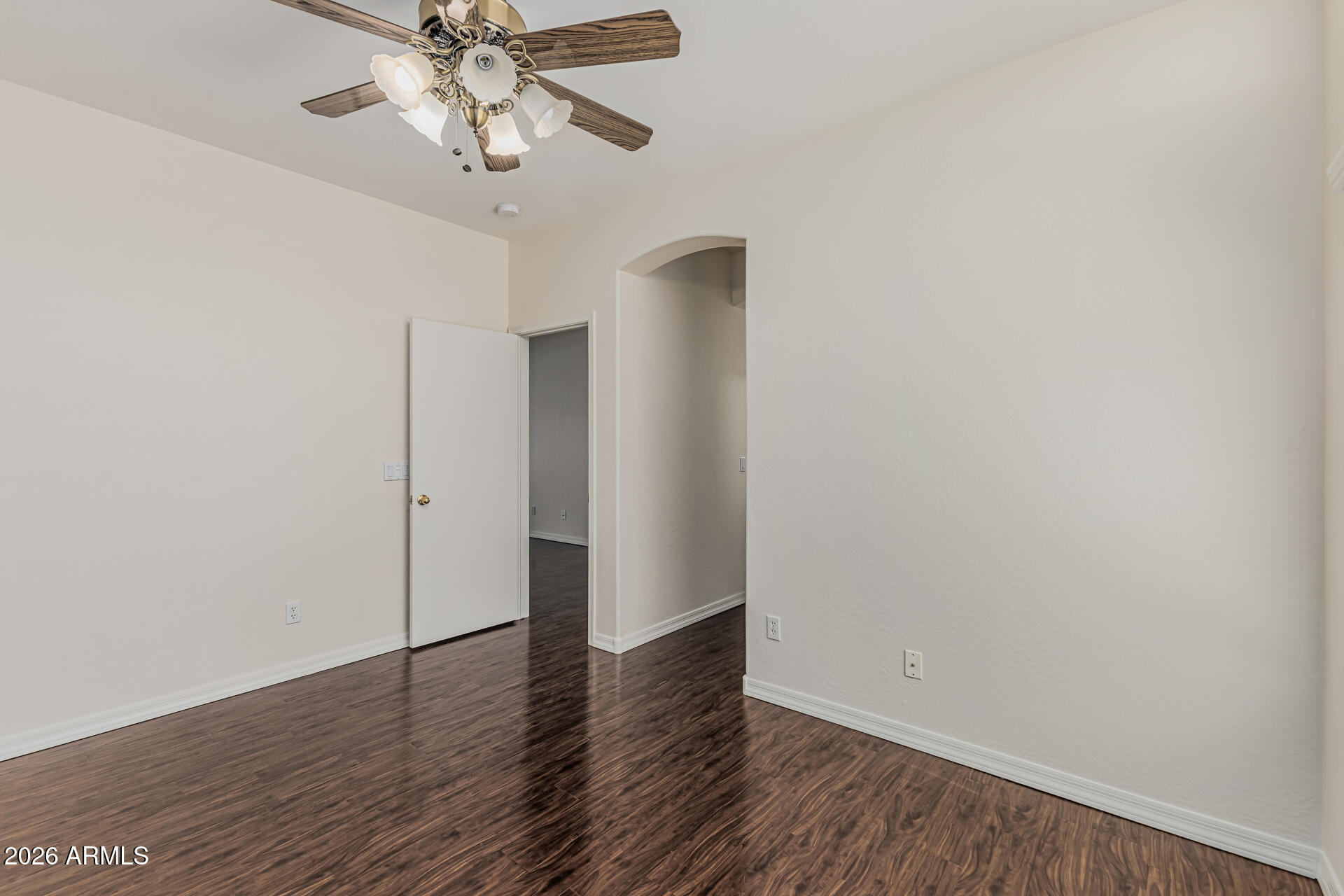 1650 South Crismon Road, Unit 16 Mesa, AZ 85209 - Photo 24 of 39 a view of an empty room with wooden floor