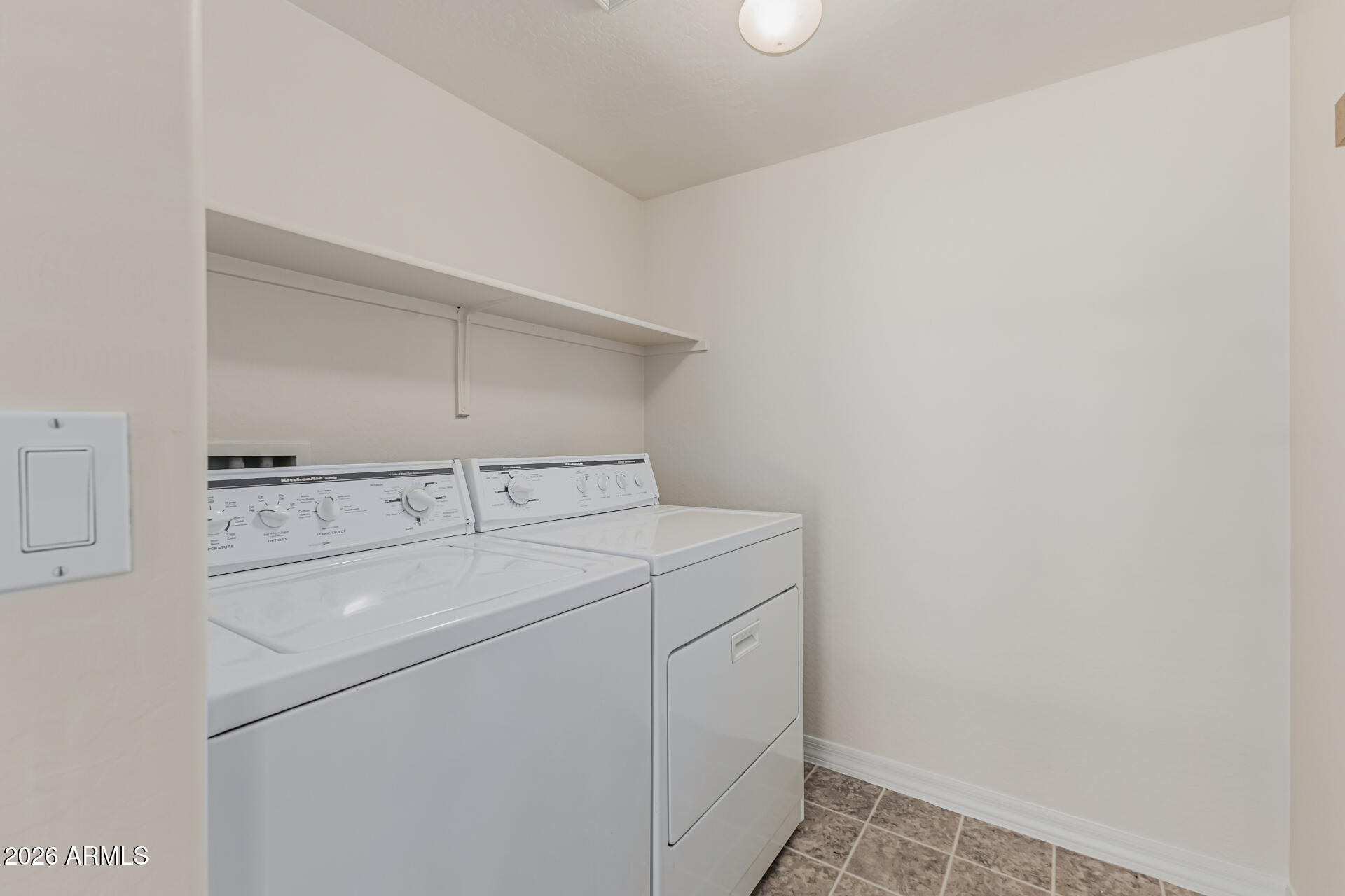 1650 South Crismon Road, Unit 16 Mesa, AZ 85209 - Photo 29 of 39 a utility room with dryer and washer
