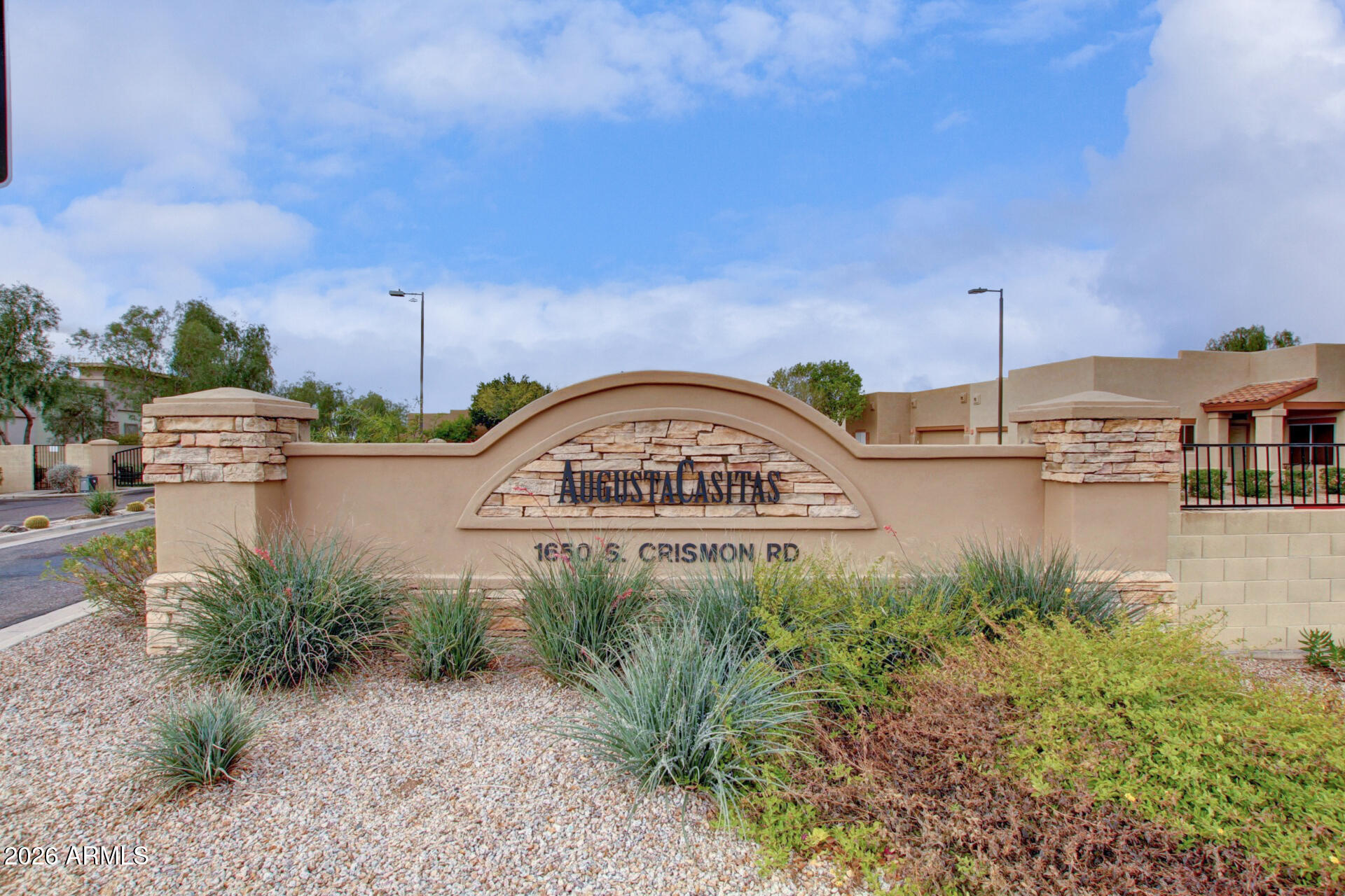 1650 South Crismon Road, Unit 16 Mesa, AZ 85209 - Photo 37 of 39 a view of a street with a building in the background