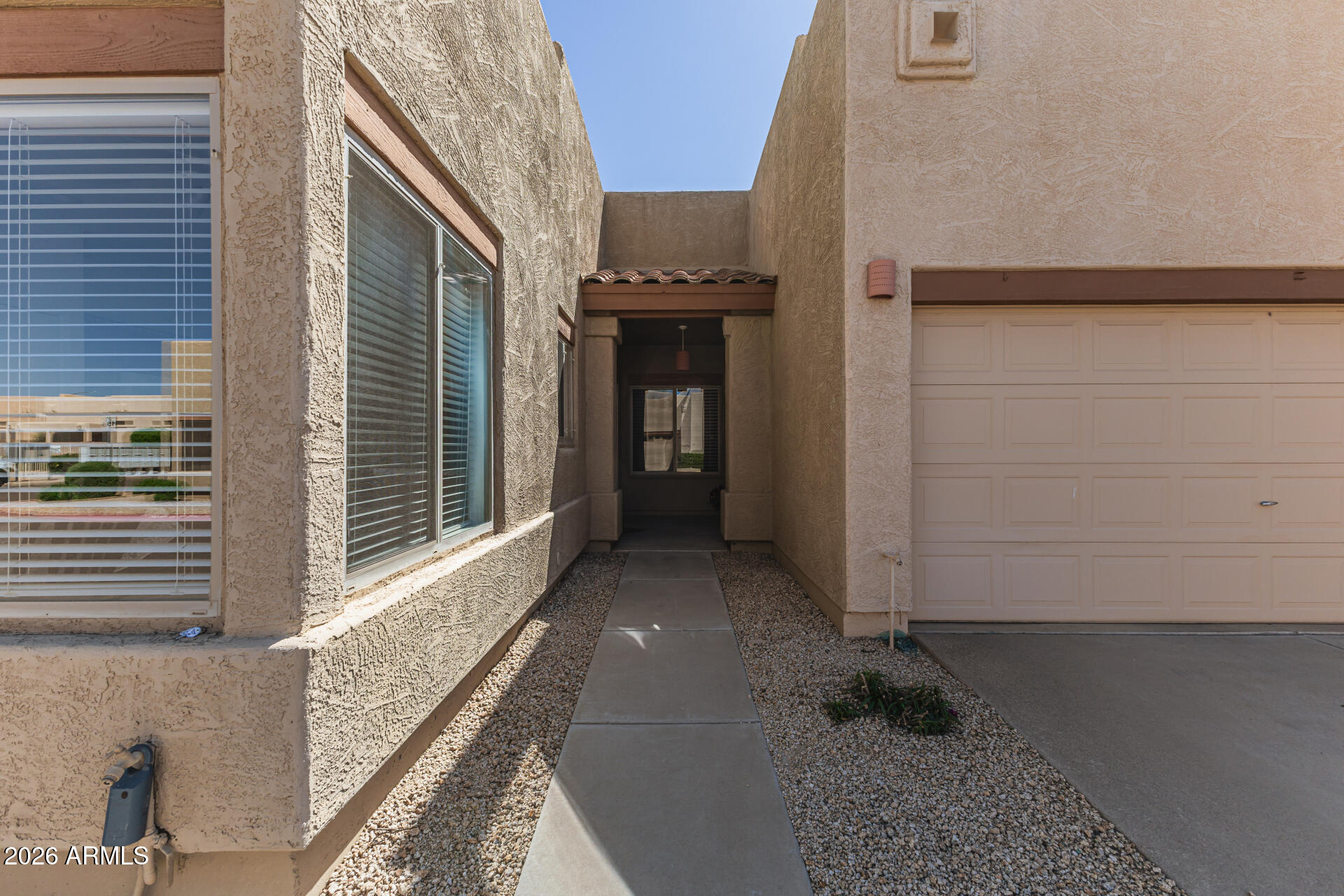 1650 South Crismon Road, Unit 16 Mesa, AZ 85209 - Photo 5 of 39 a view of a pathway of a house