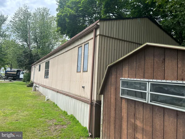 a kitchen with granite countertop a stove and a refrigerator