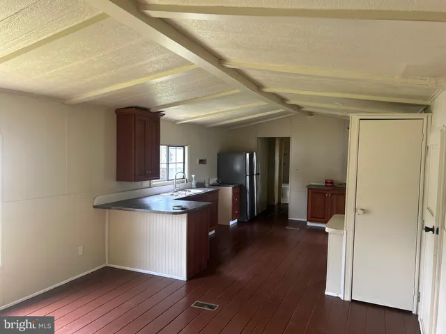 a bathroom with a sink a mirror and a window