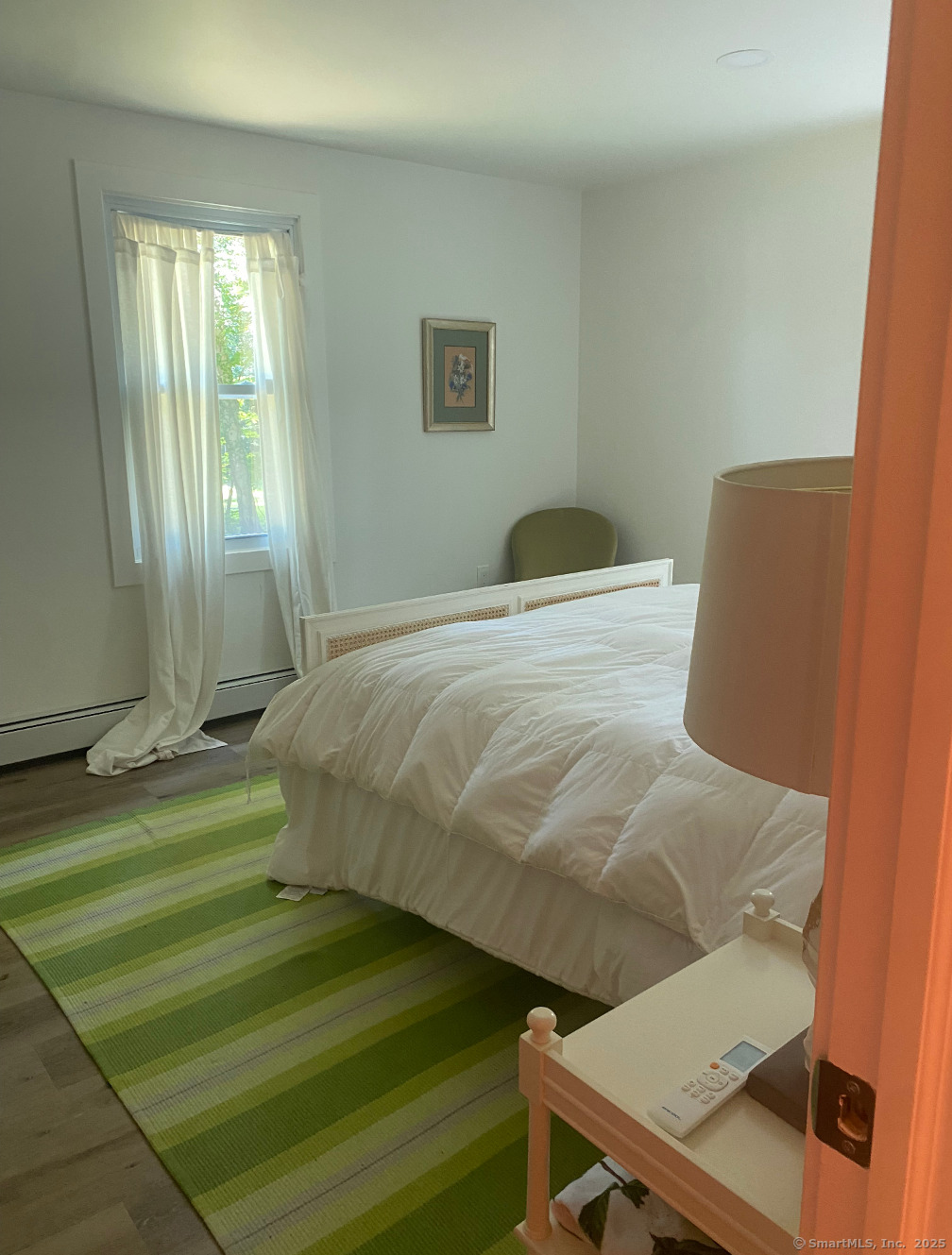 101 Cow Hill Road Clinton, CT 06413 - Photo 18 of 24 a bedroom with a bed and a window