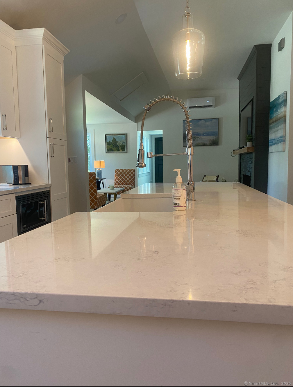 101 Cow Hill Road Clinton, CT 06413 - Photo 9 of 24 a large white kitchen with a large island