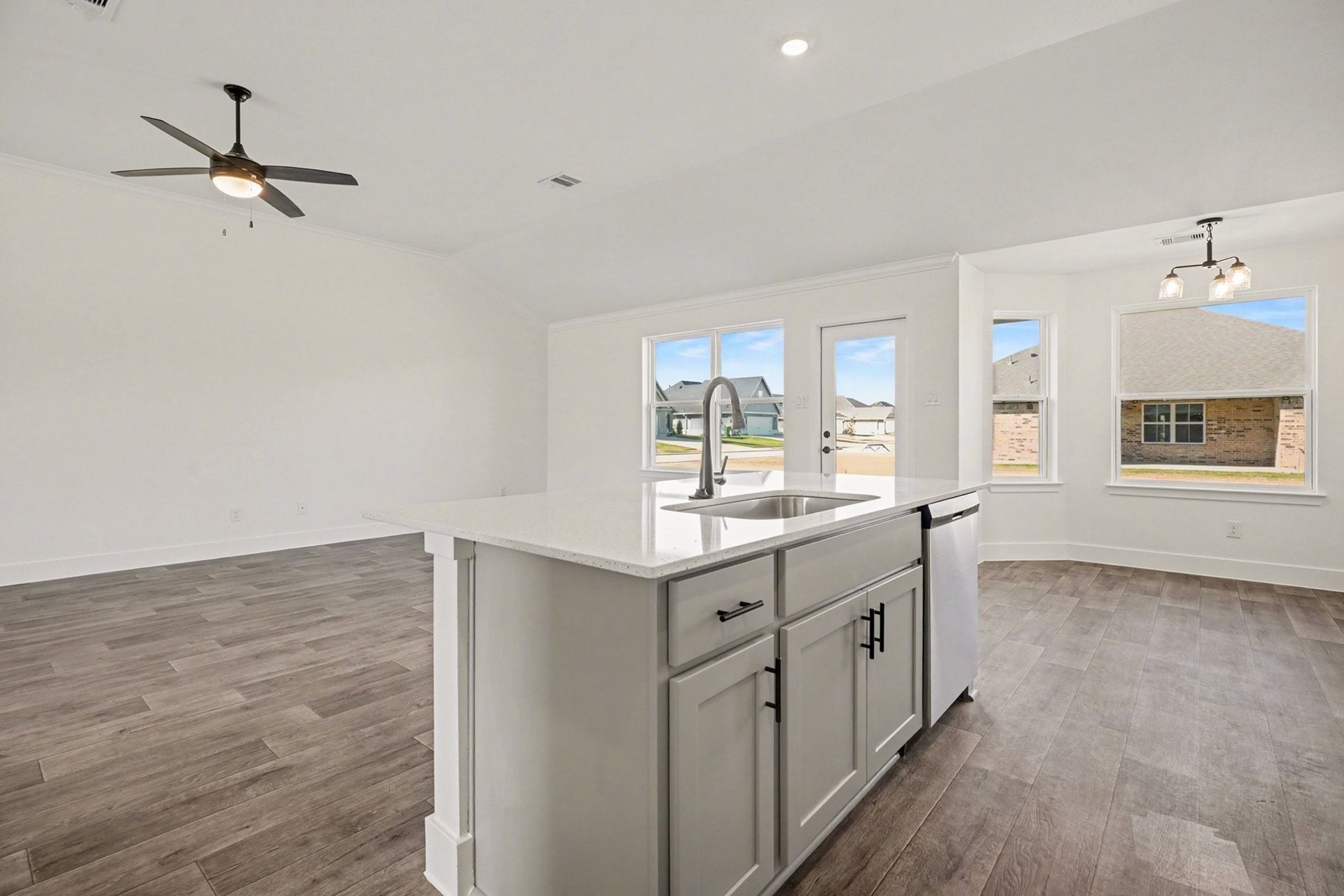 1 Keystone Court Angleton, TX 77515 - Photo 13 of 26 a kitchen with granite countertop a stove and a sink