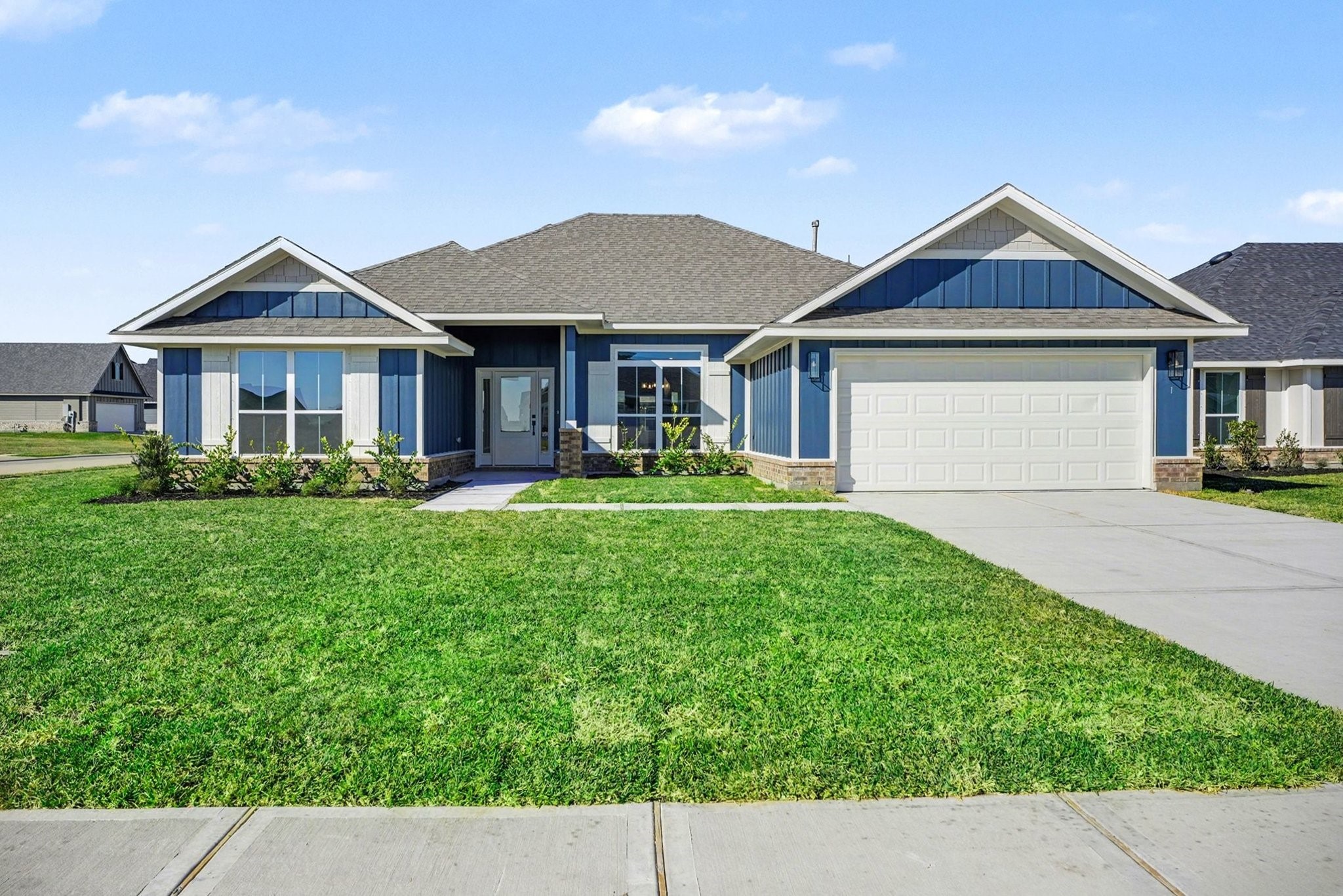 1 Keystone Court Angleton, TX 77515 - Photo 2 of 26 a front view of a house with a yard and potted plants
