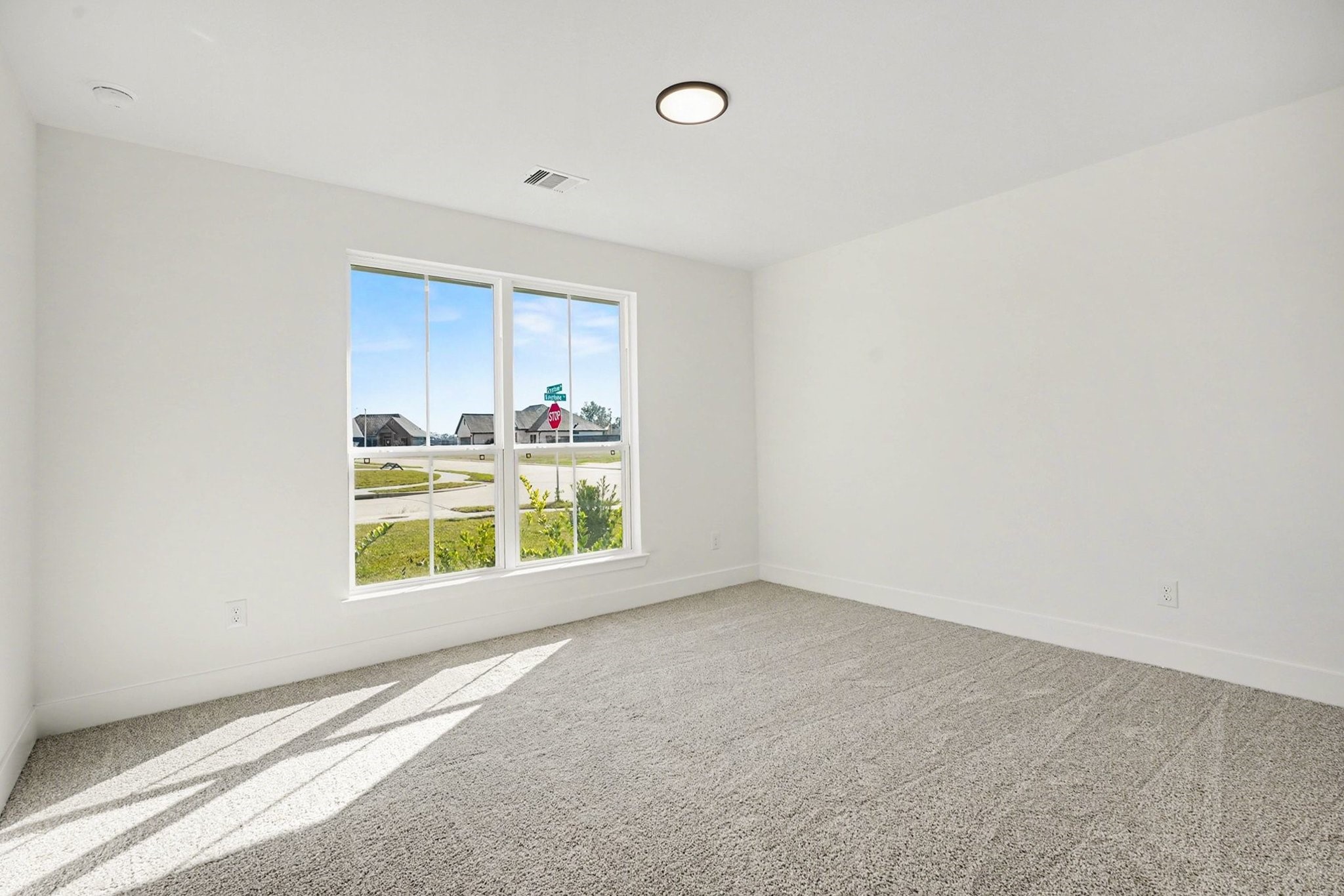 1 Keystone Court Angleton, TX 77515 - Photo 22 of 26 a view of an empty room with a window