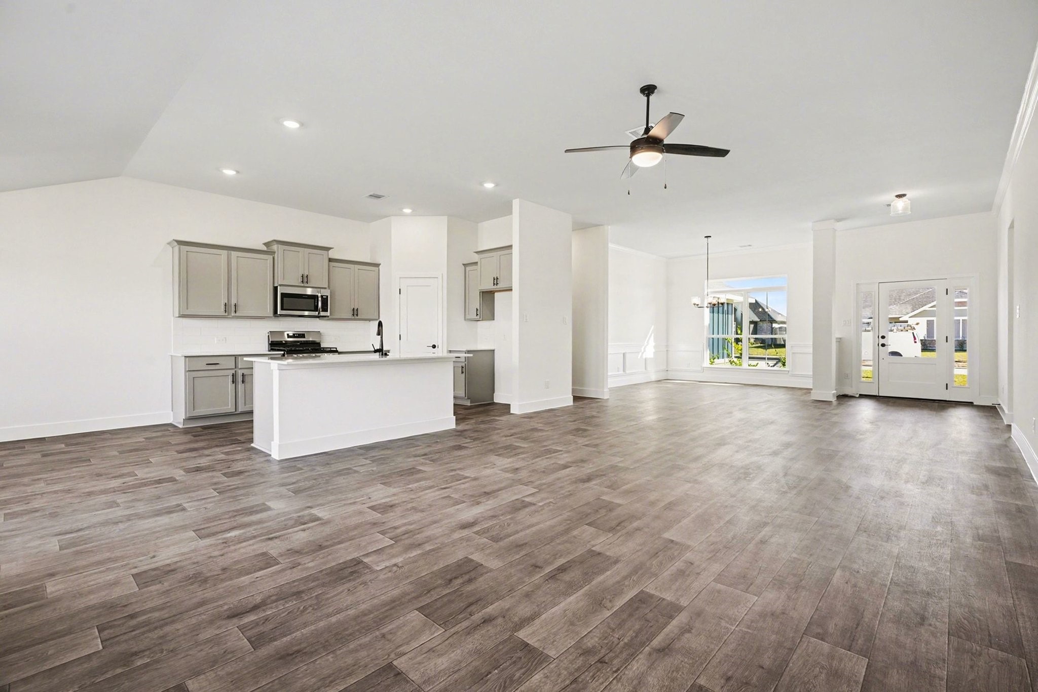 1 Keystone Court Angleton, TX 77515 - Photo 7 of 26 a view of a kitchen with a sink stove cabinets and empty space