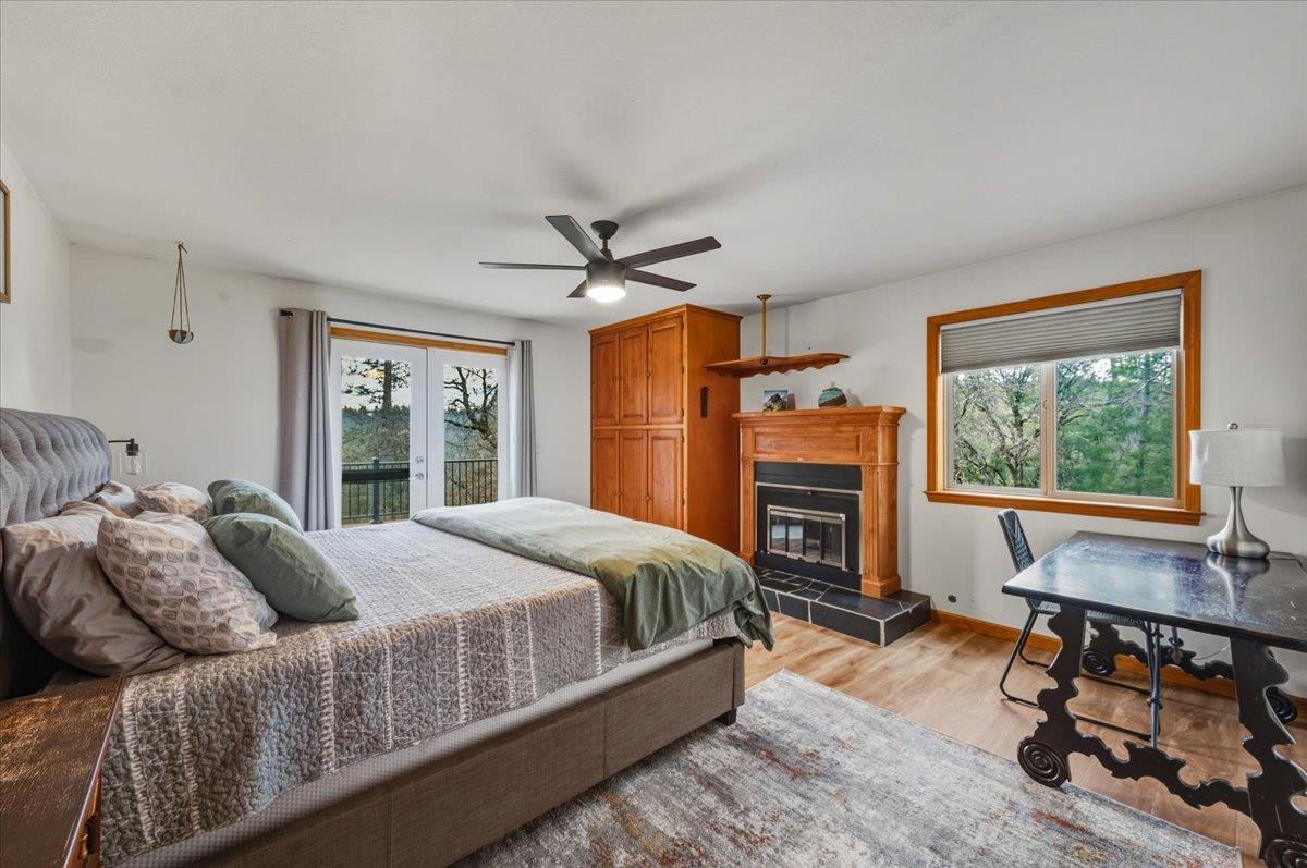 14752 Little Greenhorn Road Grass Valley, CA 95945 - Photo 12 of 35 a bed room with a bed and a chair