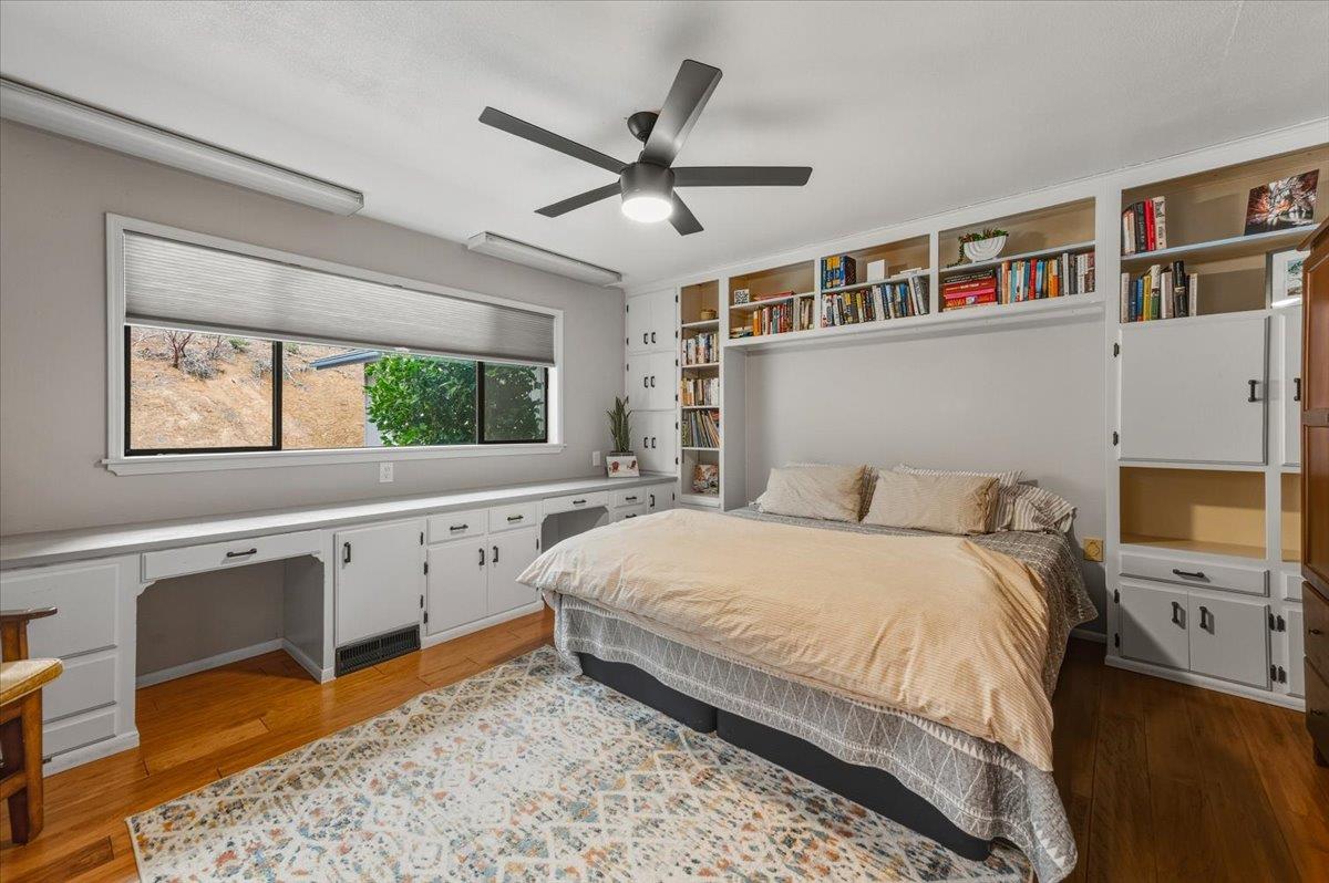14752 Little Greenhorn Road Grass Valley, CA 95945 - Photo 16 of 35 a bedroom with a large bed and a window