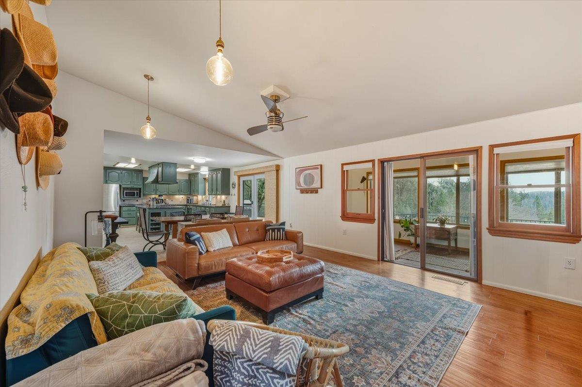 14752 Little Greenhorn Road Grass Valley, CA 95945 - Photo 3 of 35 a living room with furniture ceiling fan and a rug