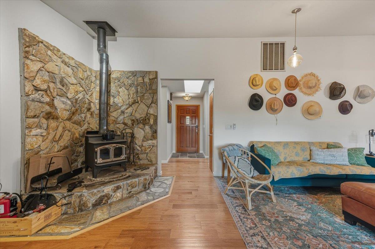 14752 Little Greenhorn Road Grass Valley, CA 95945 - Photo 4 of 35 a living room with furniture and a fireplace
