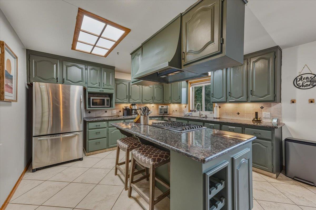14752 Little Greenhorn Road Grass Valley, CA 95945 - Photo 8 of 35 a kitchen with stainless steel appliances granite countertop a sink a stove a refrigerator and cabinets