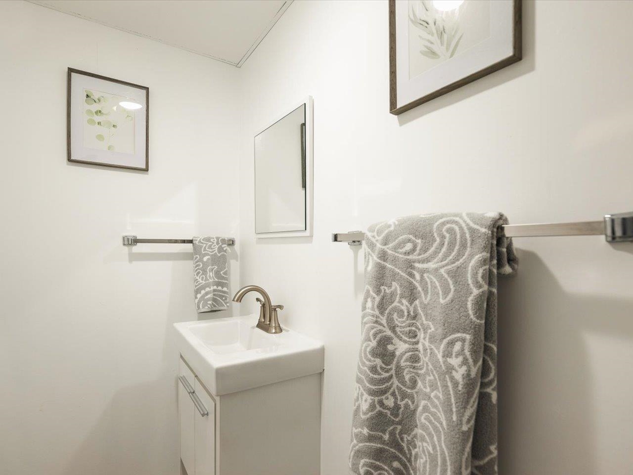136 Lake Summerset Road Lake Summerset, IL 61019 - Photo 26 of 47 a bathroom with a sink and a mirror