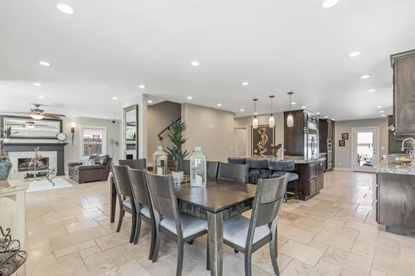 a dining area with a table and chairs in it