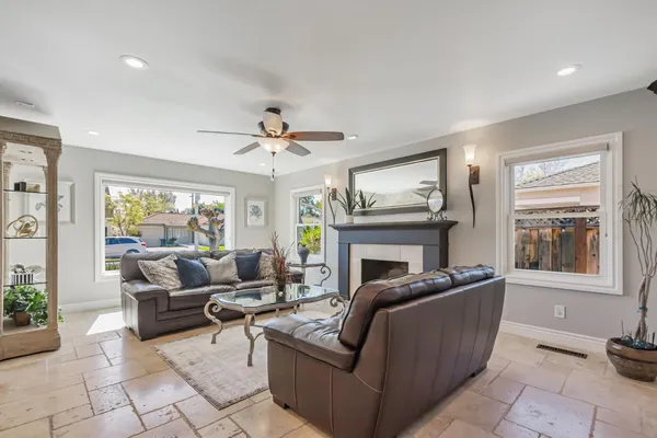 a living room with furniture and a fireplace