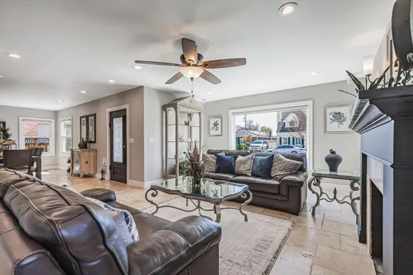 a living room with furniture and a chandelier