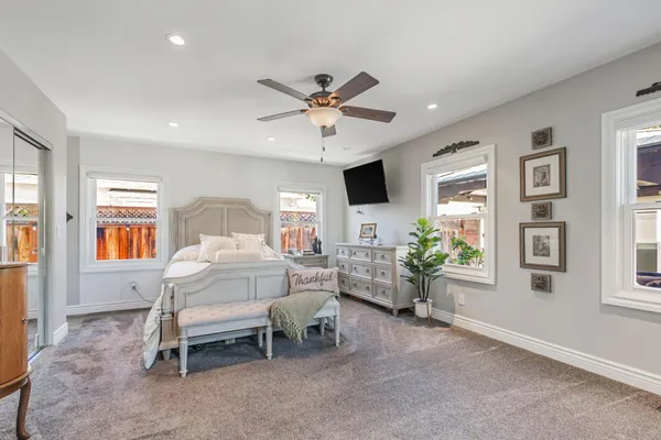 a bedroom with furniture and a window