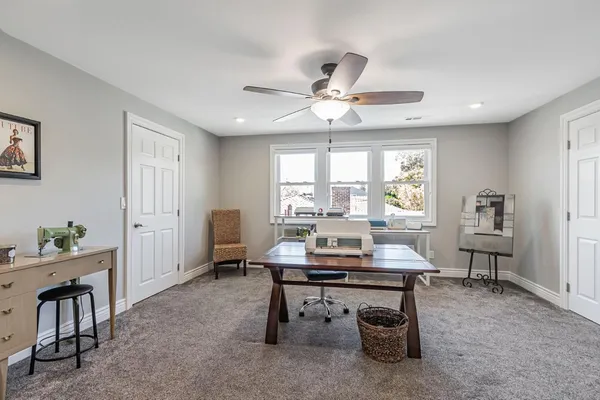 a workspace with furniture and window