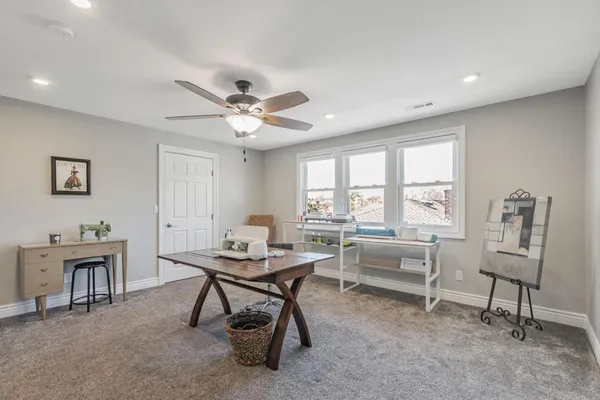 a workspace with furniture and window