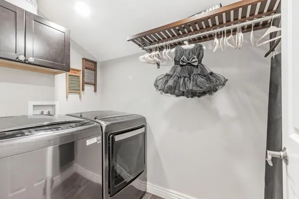 a kitchen with a stove and a refrigerator
