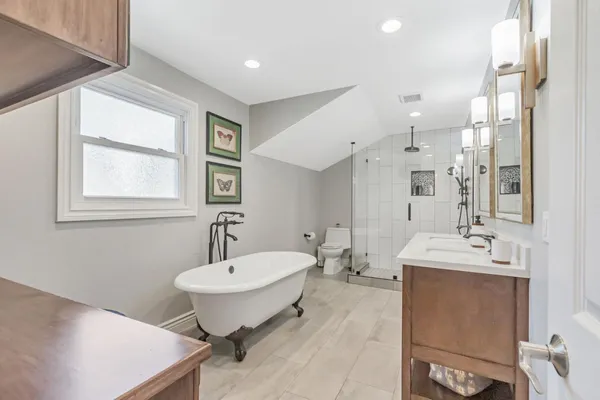 a bathroom with a sink double vanity and a mirror
