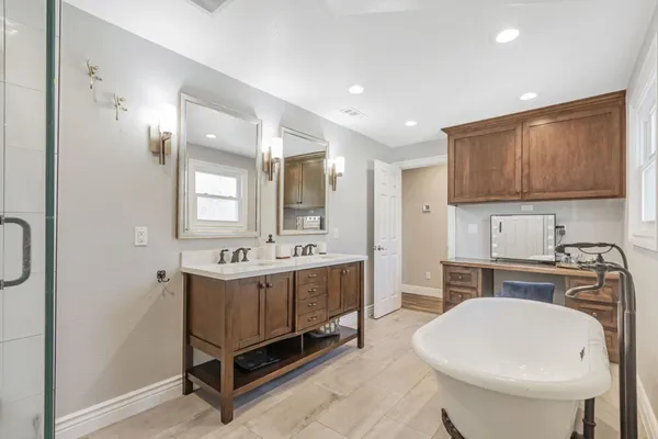a bathroom with a sink double vanity and a mirror
