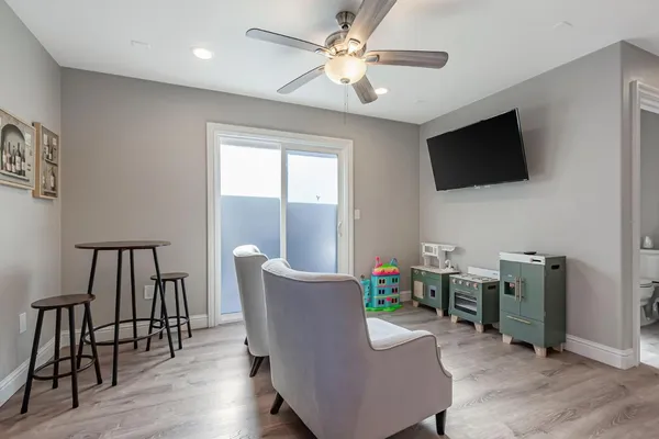 a workspace with furniture window and wooden floor