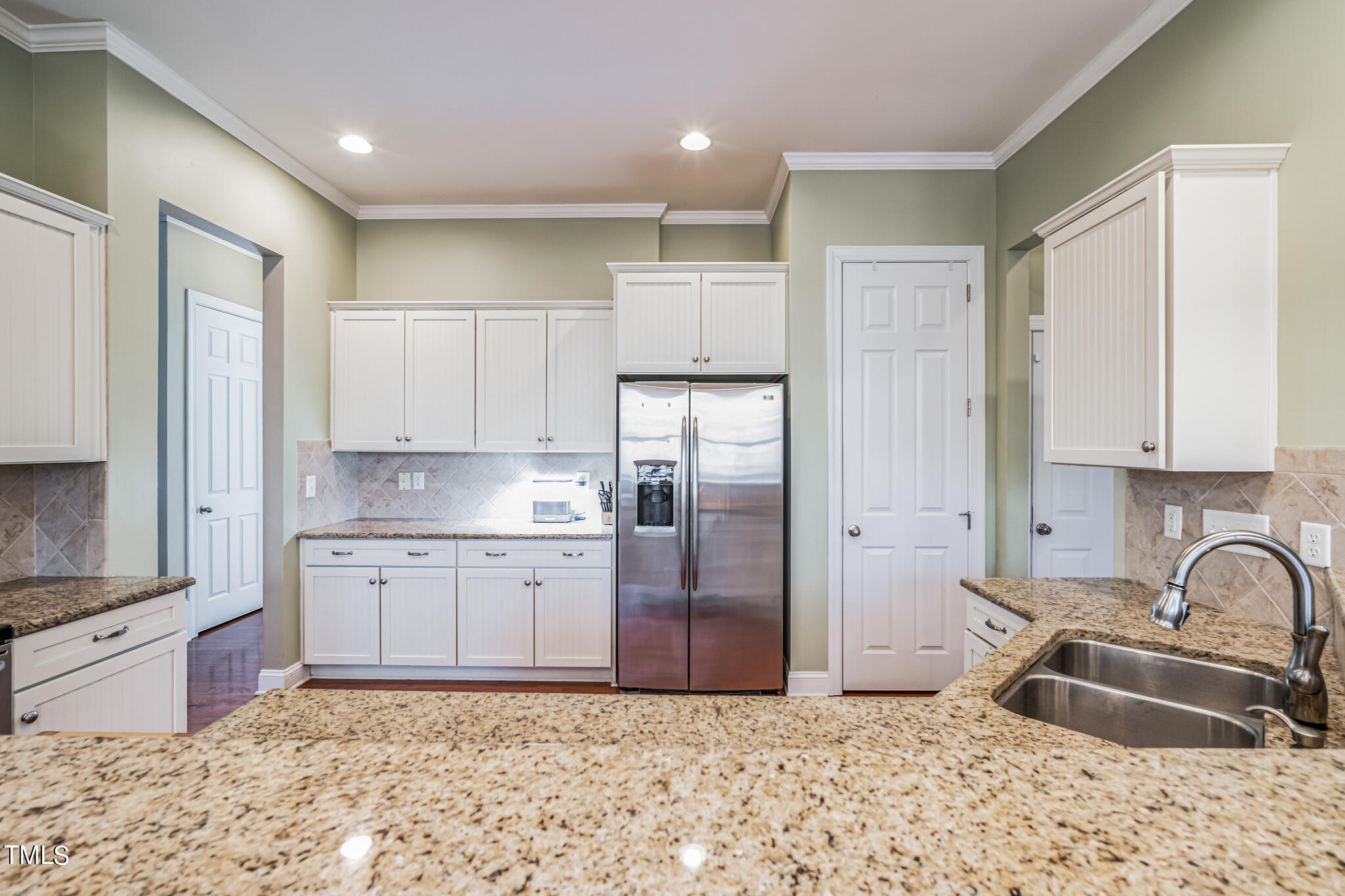 1104 Chapanoke Road Raleigh, NC 27603 - Photo 11 of 31 a kitchen with granite countertop a sink stove and refrigerator