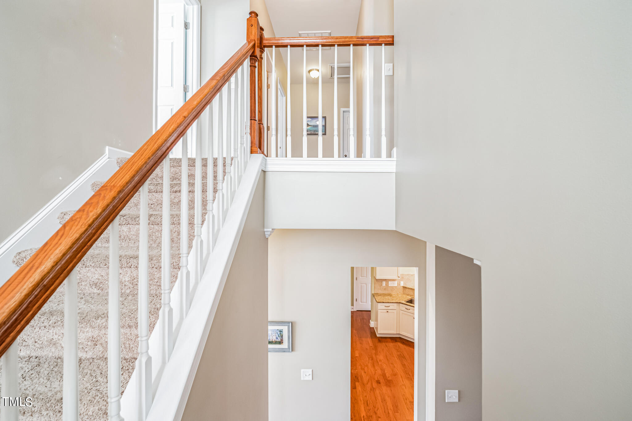 1104 Chapanoke Road Raleigh, NC 27603 - Photo 16 of 31 a view of staircase with railing and a window