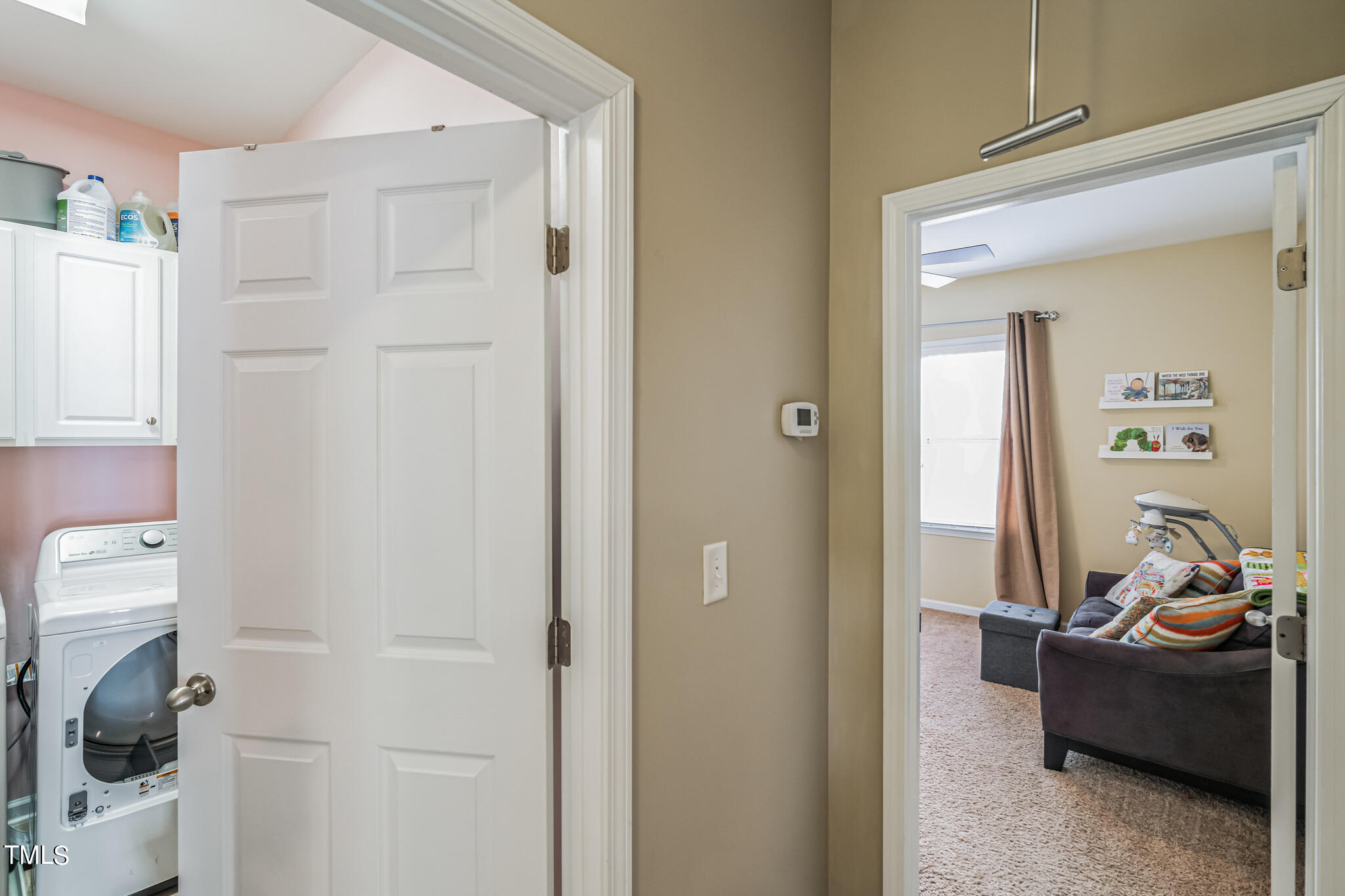 1104 Chapanoke Road Raleigh, NC 27603 - Photo 28 of 31 a living room with furniture and a hallway