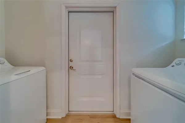 a bathroom with a granite countertop toilet sink and mirror