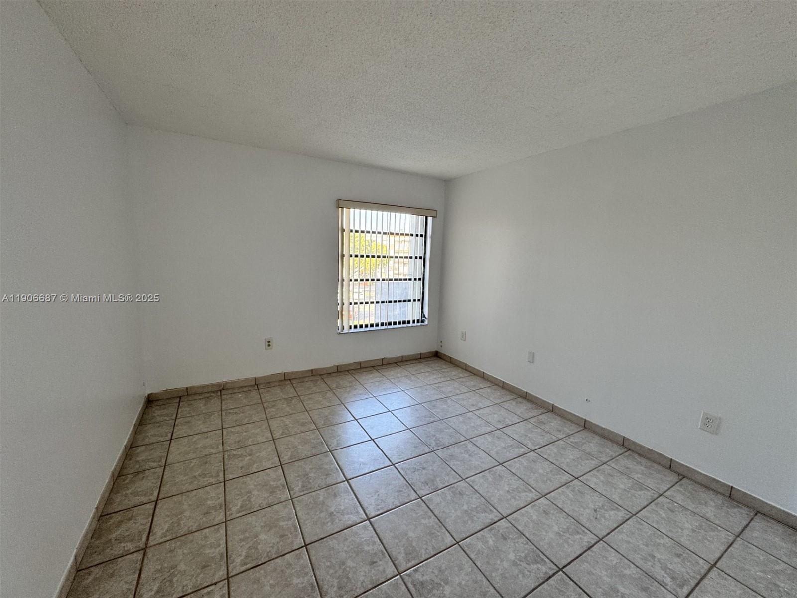 5800 Southwest 127th Avenue, Unit 2307 Miami, FL 33183 - Photo 11 of 23 an empty room with windows