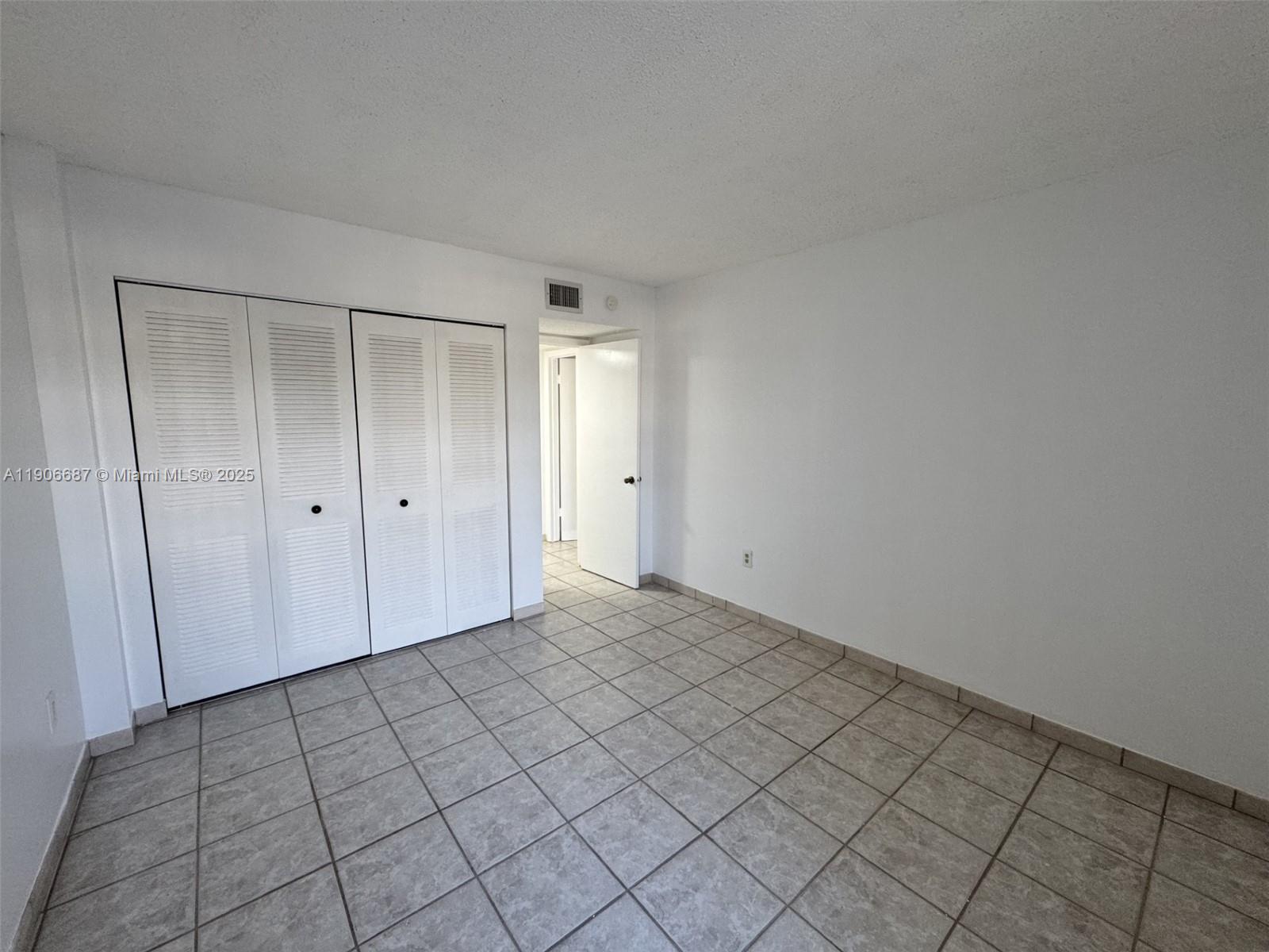 5800 Southwest 127th Avenue, Unit 2307 Miami, FL 33183 - Photo 12 of 23 a view of an empty room and window