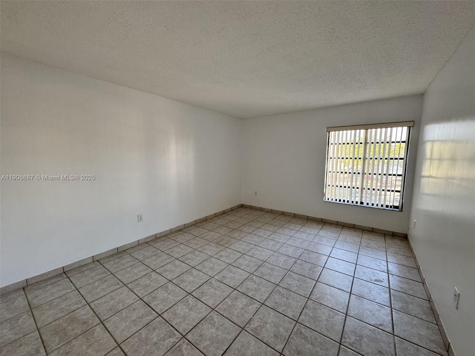 5800 Southwest 127th Avenue, Unit 2307 Miami, FL 33183 - Photo 16 of 23 an empty room with windows