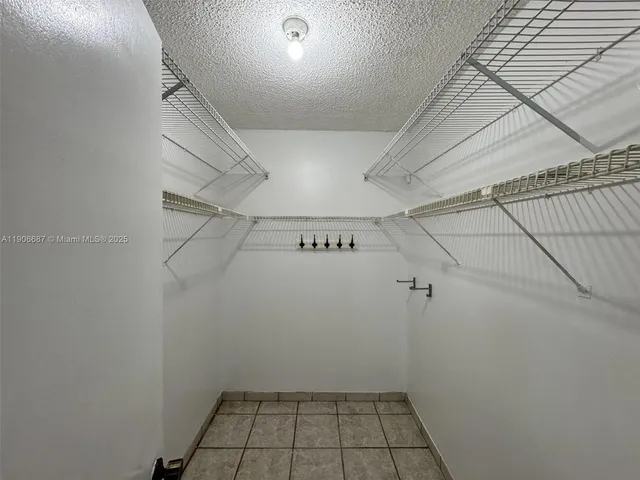 a view of a room with racks on the wall