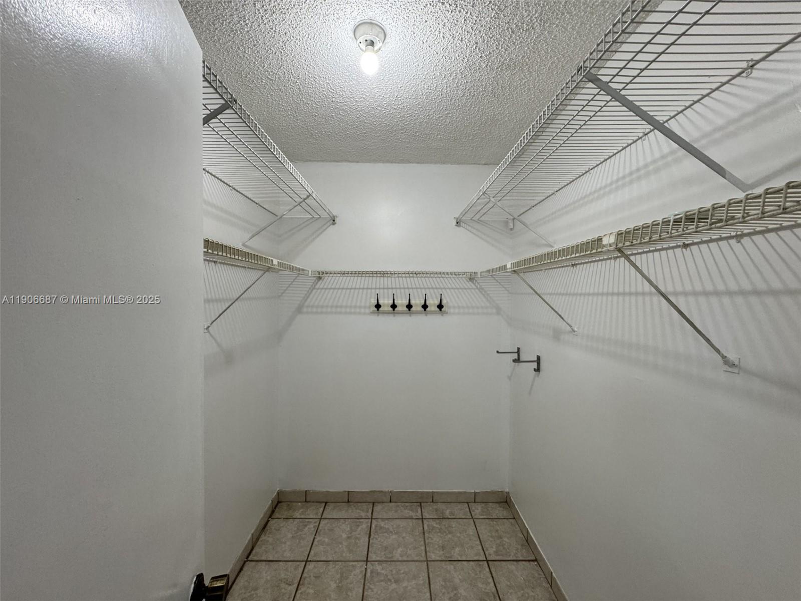 5800 Southwest 127th Avenue, Unit 2307 Miami, FL 33183 - Photo 17 of 23 a view of a room with racks on the wall