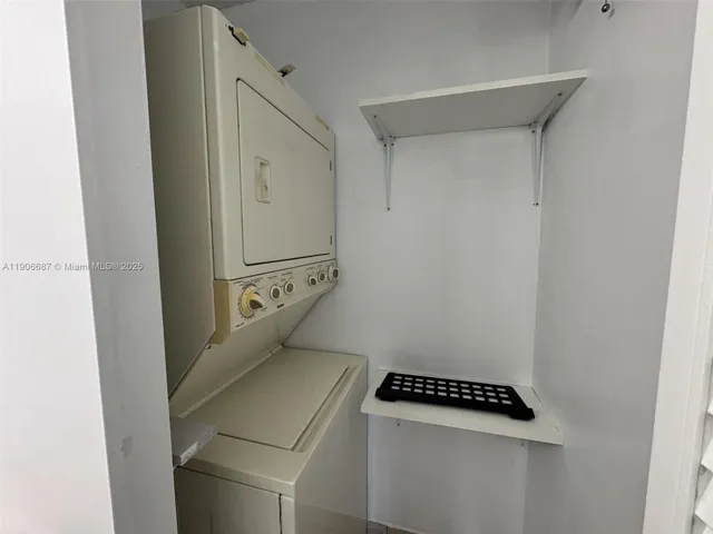 a view of a chair and tables in the terrace