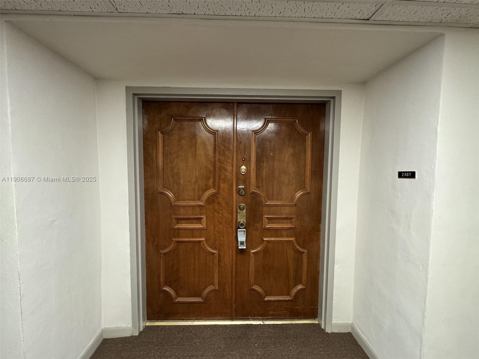 5800 Southwest 127th Avenue, Unit 2307 Miami, FL 33183 - Photo 4 of 23 a view of a wooden door