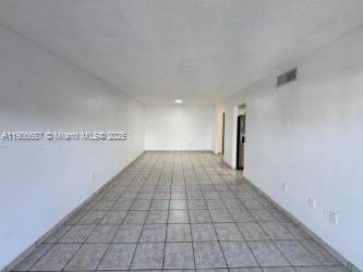 5800 Southwest 127th Avenue, Unit 2307 Miami, FL 33183 - Photo 5 of 23 a view of a room with an empty space and a window