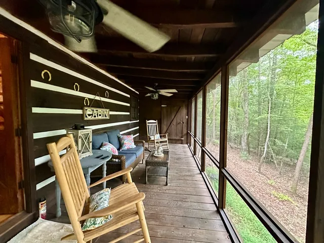 a view of swimming pool with seating area