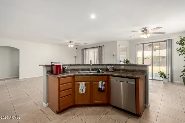 a kitchen with stainless steel appliances granite countertop a stove and a sink