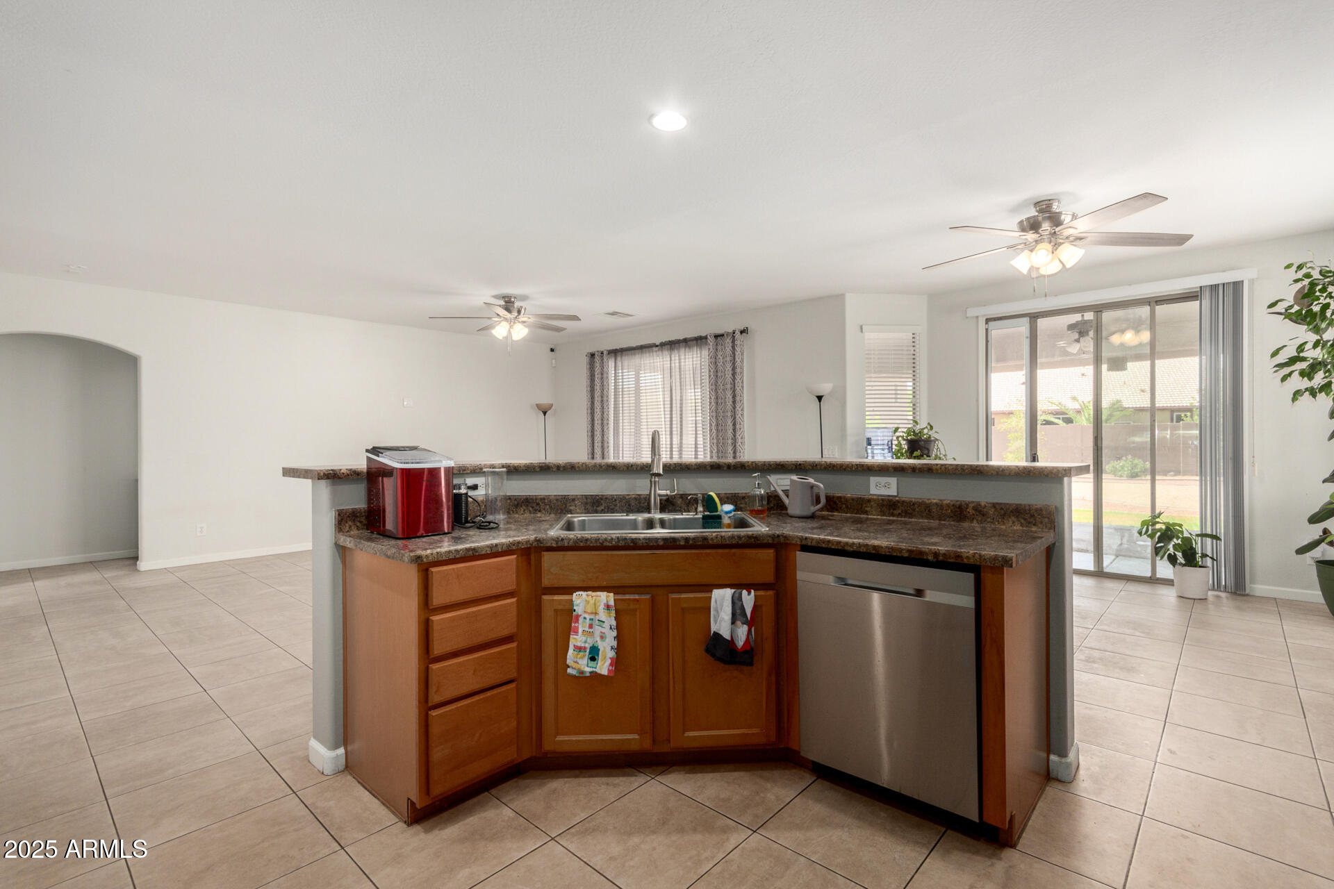 2413 West Beverly Rd. Phoenix, AZ 85041 - Photo 11 of 28 a kitchen with stainless steel appliances granite countertop a stove and a sink
