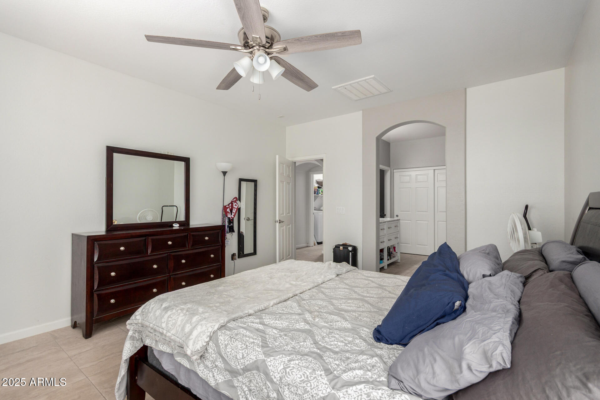 2413 West Beverly Rd. Phoenix, AZ 85041 - Photo 15 of 28 a bed room with a bed and a dresser