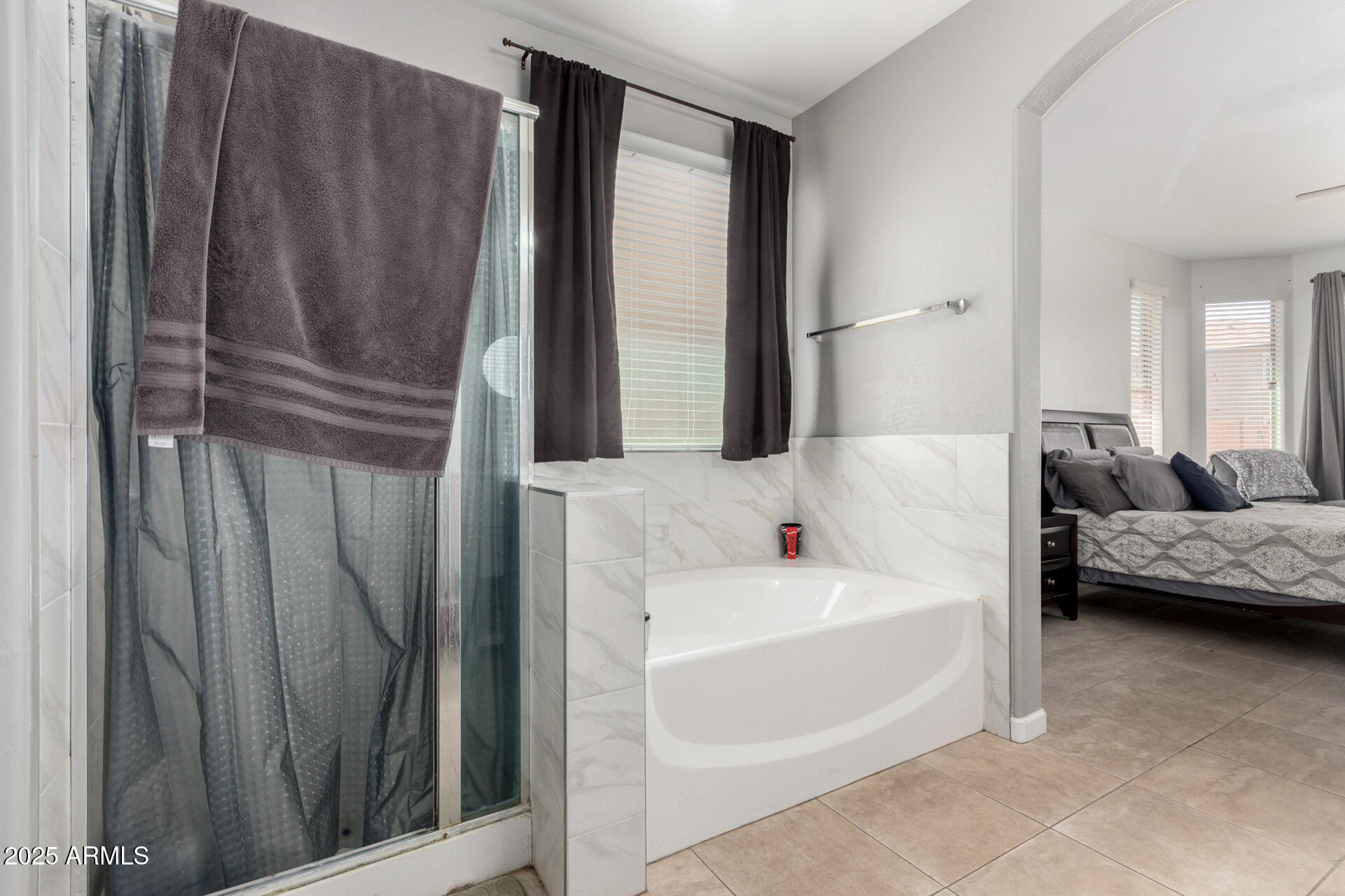 2413 West Beverly Rd. Phoenix, AZ 85041 - Photo 18 of 28 a bathroom with a tub and a shower